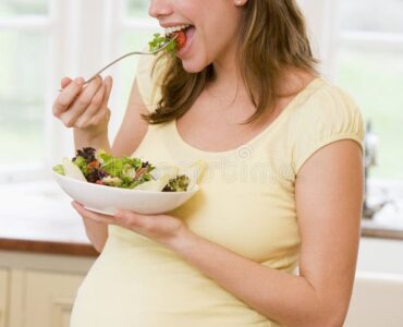 Pregnant Woman in Kitchen Eating a Salad Smiling Stock Photo Image of salad mother 5943396 Pregnant Woman in Kitchen Eating a Salad Smiling Stock Photo Image of salad mother 5943396