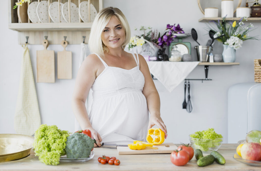 front view pregnant woman kitchen front view pregnant woman kitchen