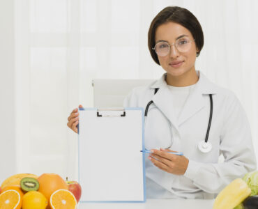 medium shot nutritionist holding clipboard medium shot nutritionist holding clipboard